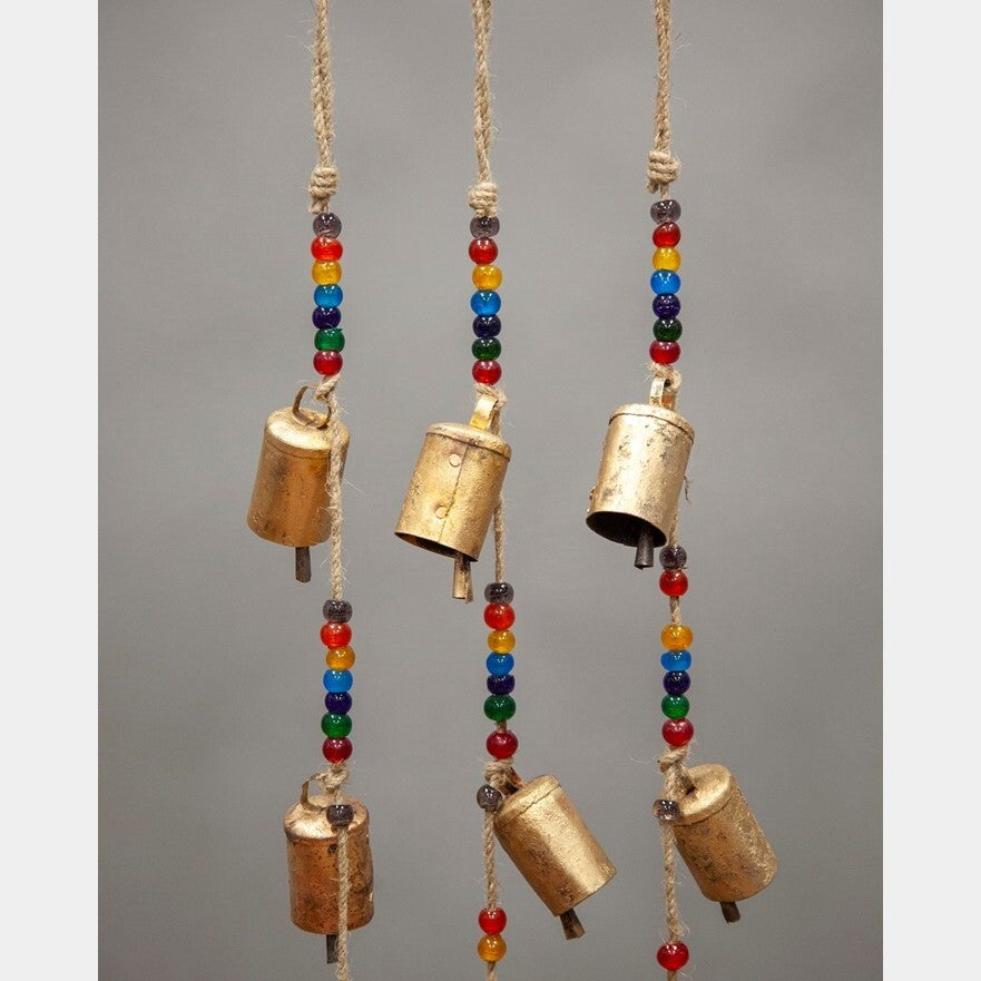 Tin bells with rainbow chakra beads hanging from natural jute cord