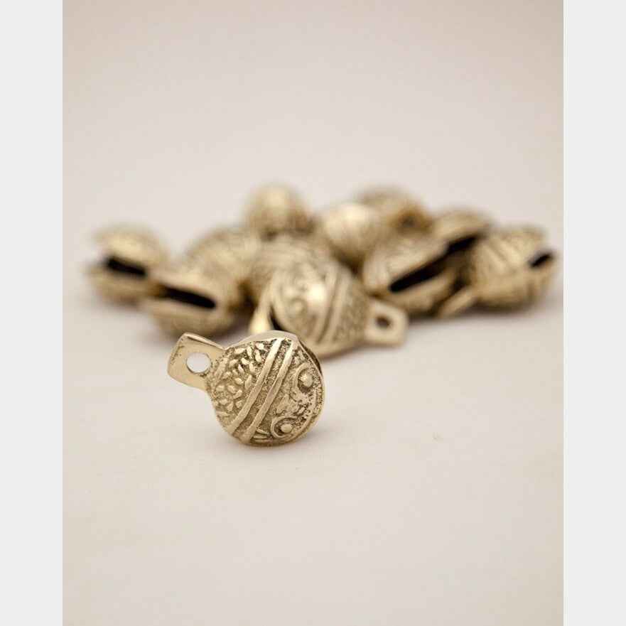 Dozen Single-Cut Embossed Brass Bells