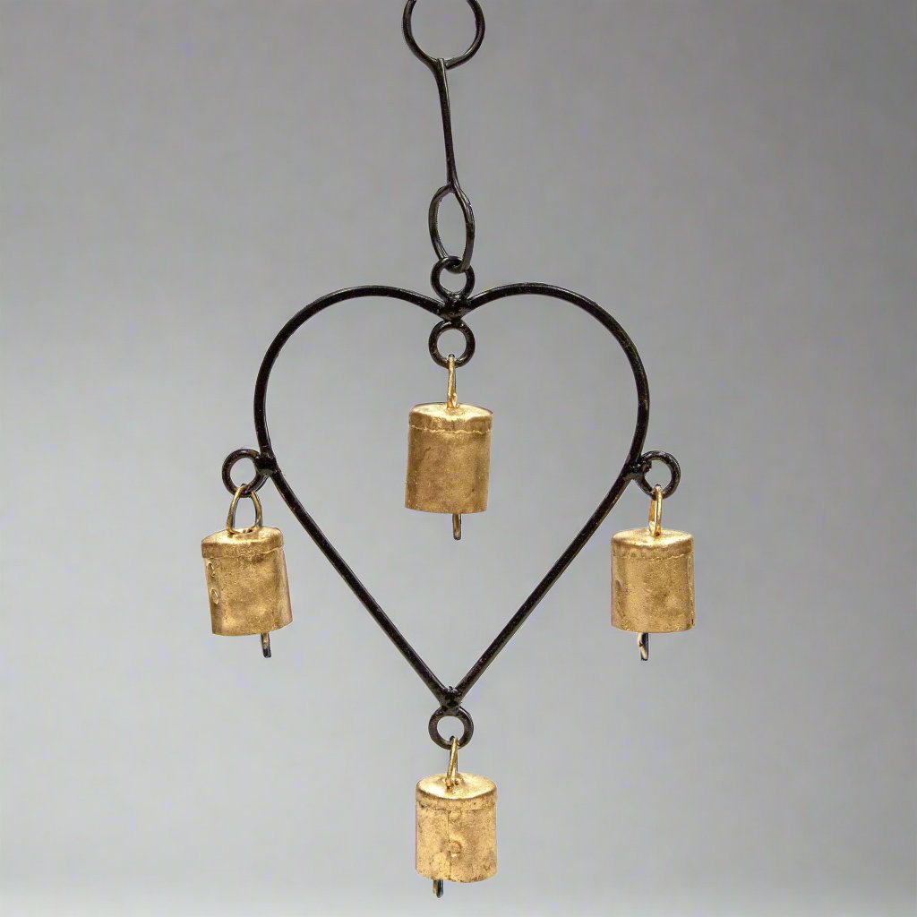 Iron heart shaped chime with four small tin bells hanging from a black iron frame, 7.25 inches tall, TS102.