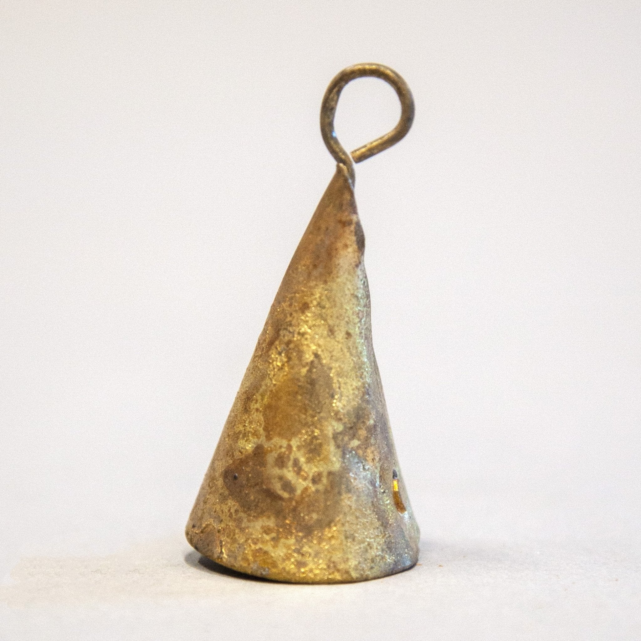 Close-up of cone-shaped tin bells with a ringing sound, perfect for festive and decorative use.