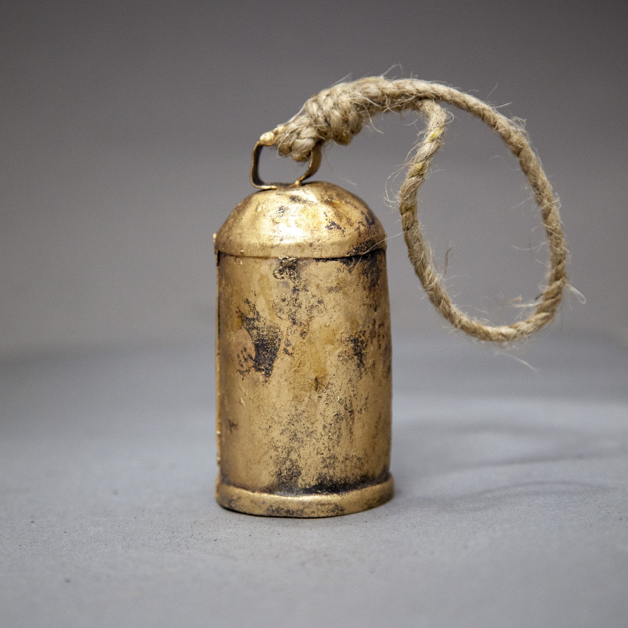 4" tall tin bell with wooden striker