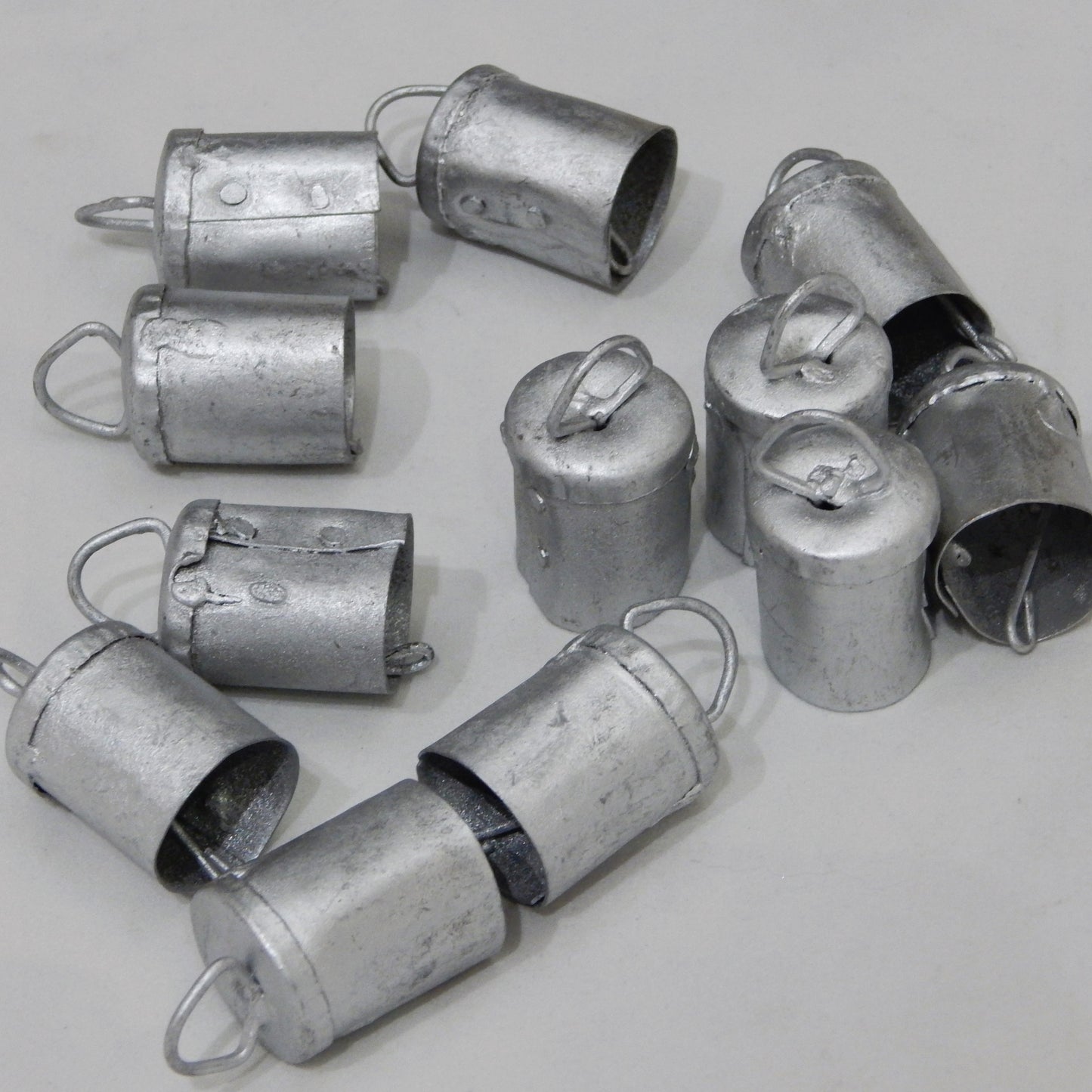 dozen vintage silver tin bells